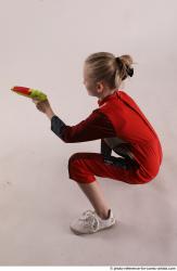 DENISA SITTING POSE WITH GUN